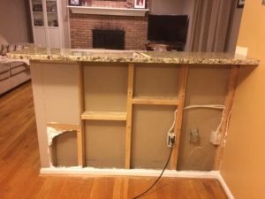 Tools and materials used to build a half wall in kitchen