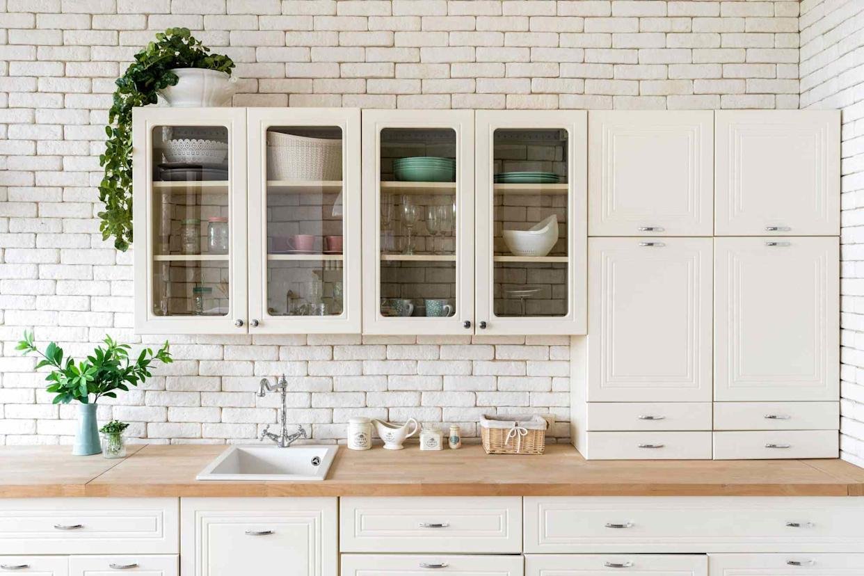 how to decor empty space above kitchen cabinet