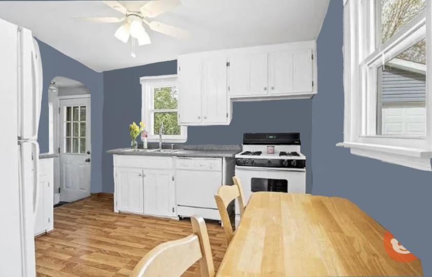 Modern white kitchen with soft grey walls
