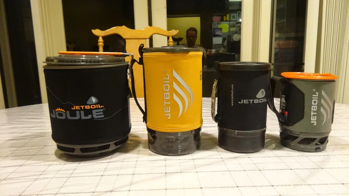 canister stove vs liquid fuel stove vs integrated cooking system